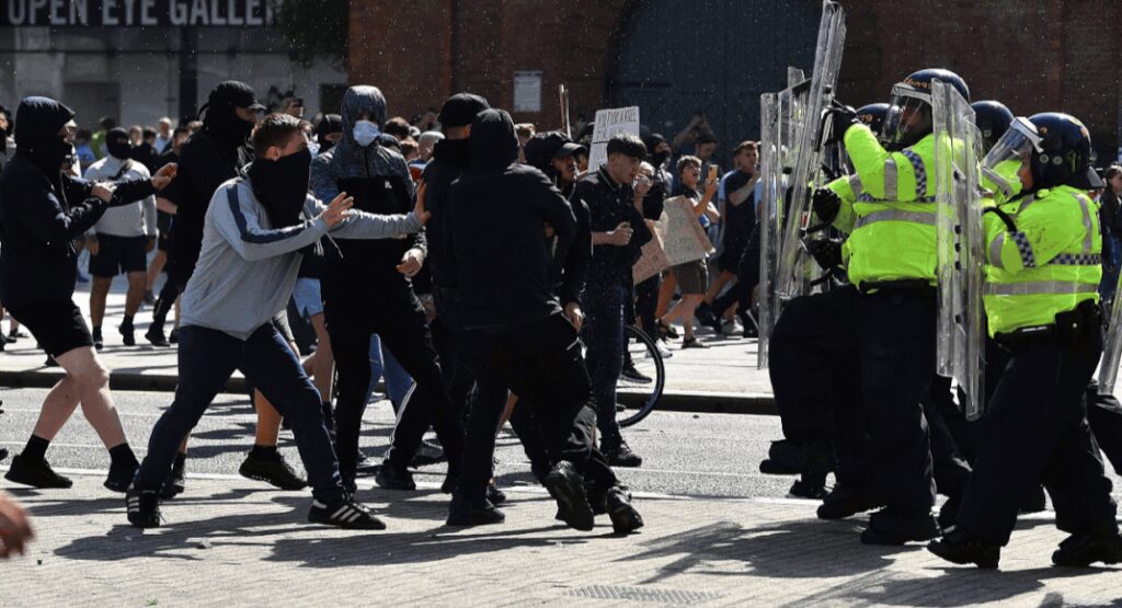 Bricks, bottles and razor blades: UK riots takes violent turn as police, far-right group clash