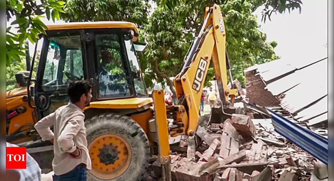 UP bulldozes 'illegal' bakery of SP neta accused of rape | India News