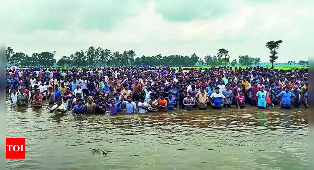 Desperate to escape to India, Bangladeshis wait in rivulet | India News