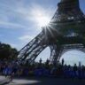 Eiffel Tower evacuated after man climbs up ahead of Paris Olympics closing ceremony